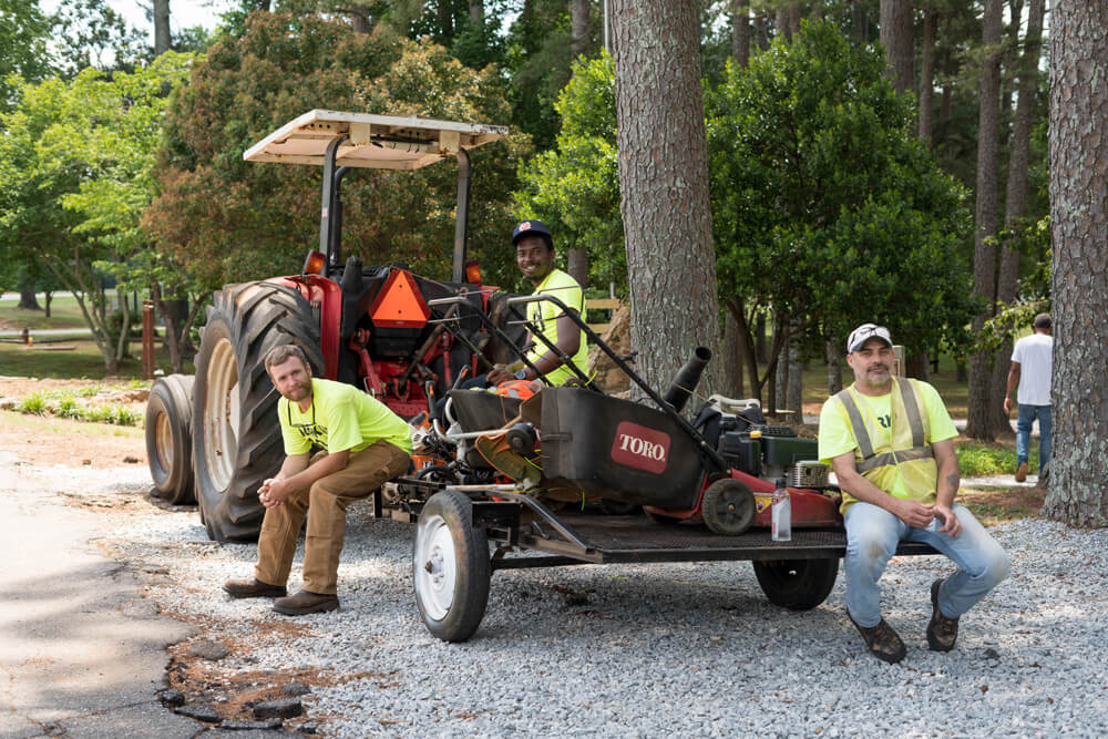 Men at TPH with lawnmower