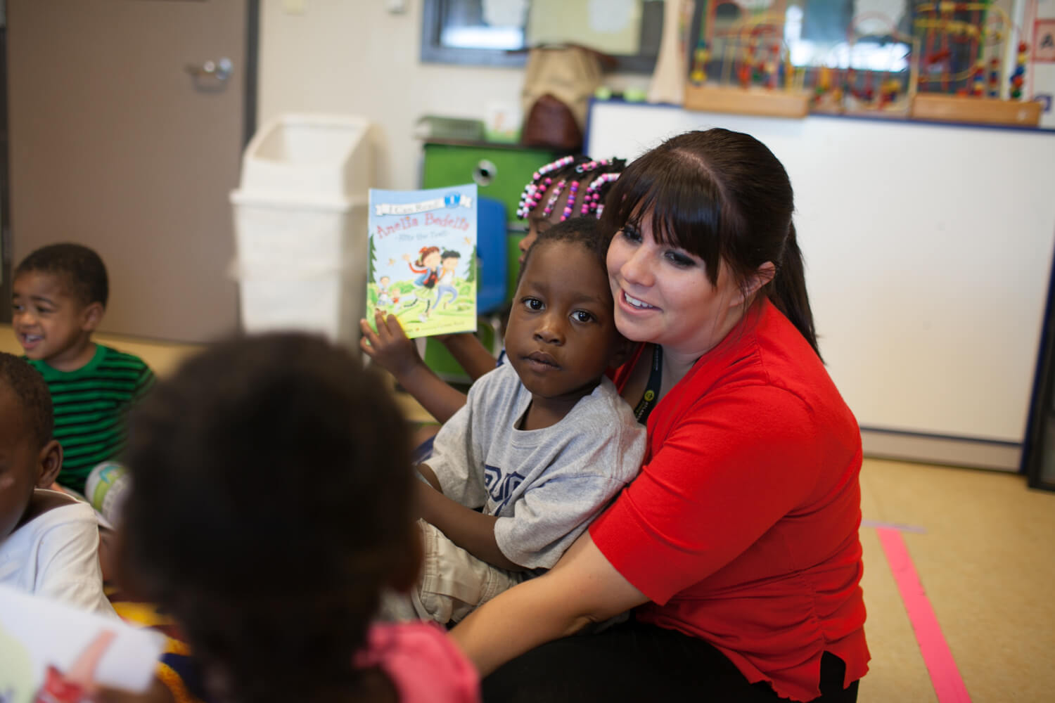 woman holding a little girl on her lap at Atlanta Mission