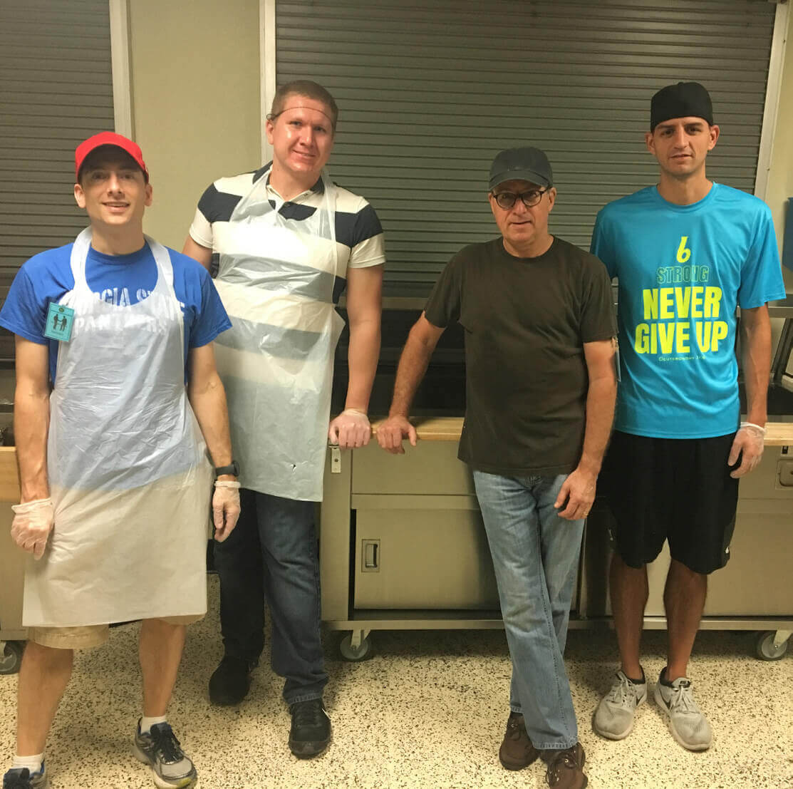 Peter McHale and friends, volunteering in the kitchen at The Shepherd's Inn