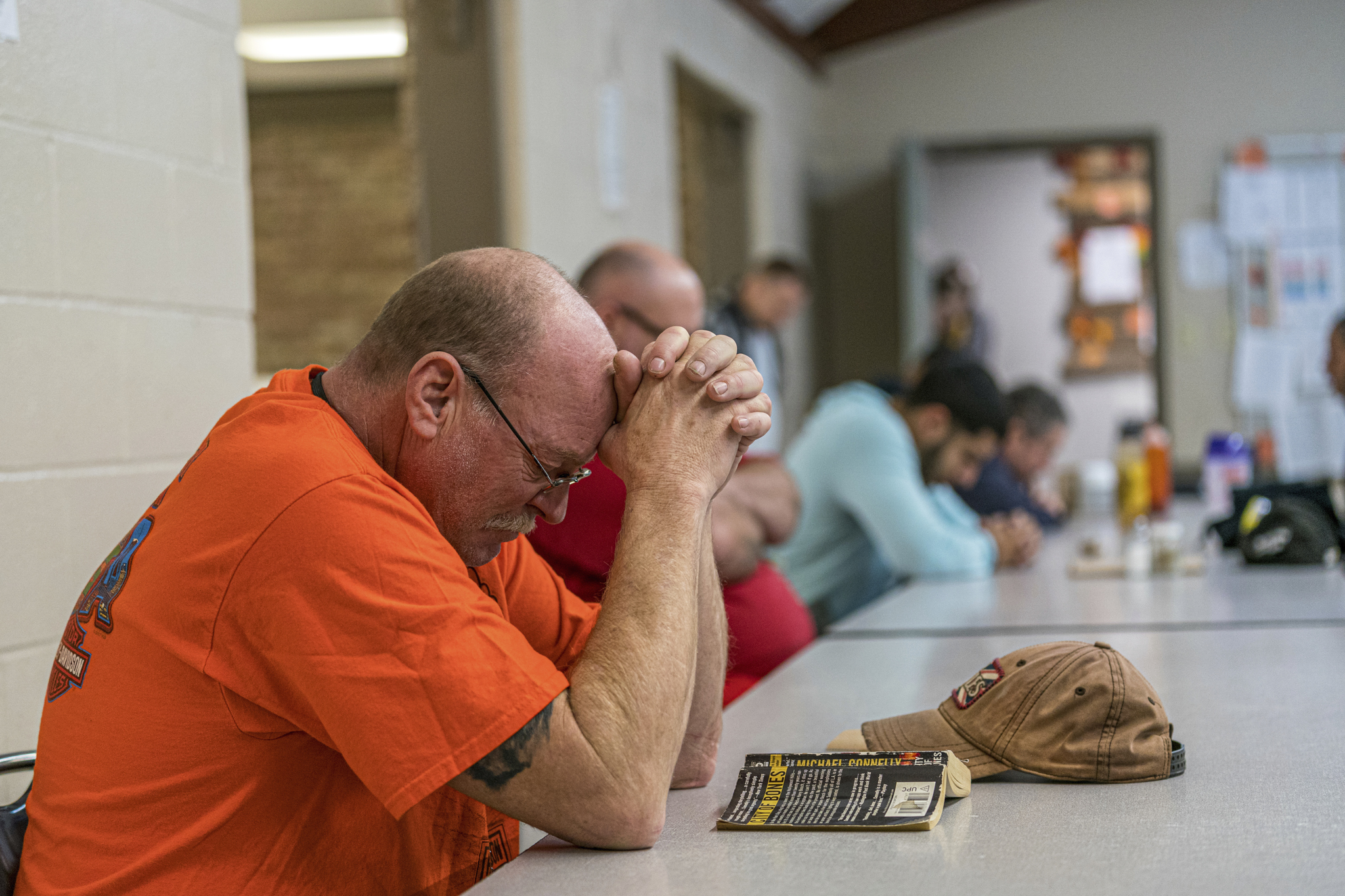 man praying at atlanta mission