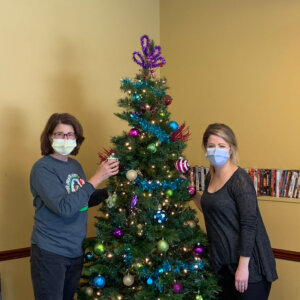 two women and christmas tree