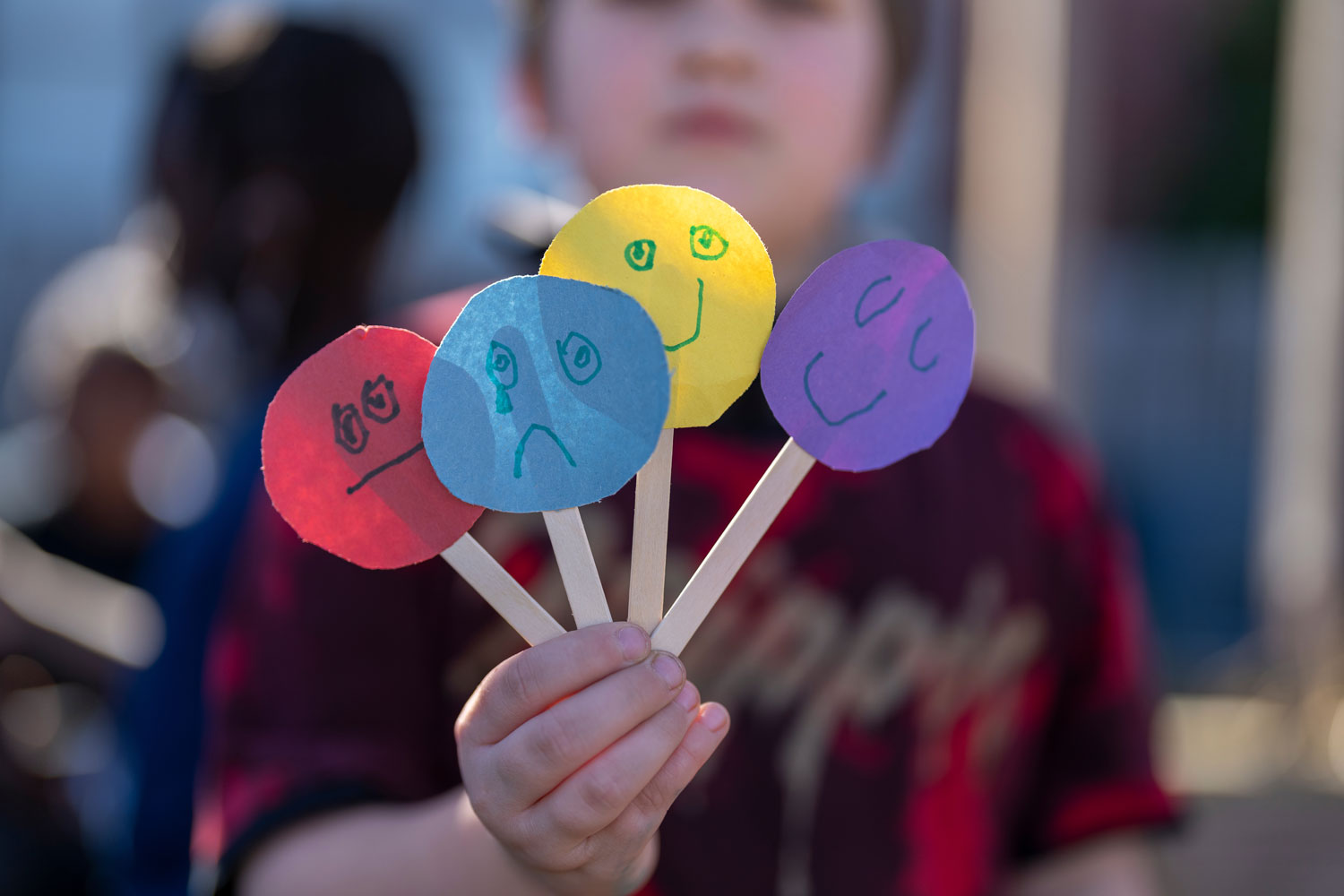 Boy showing sticks with emotions at MSH