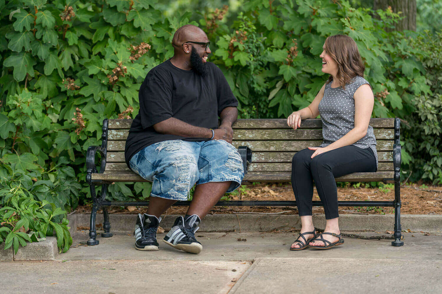 2023 May E-News two people talking on a bench