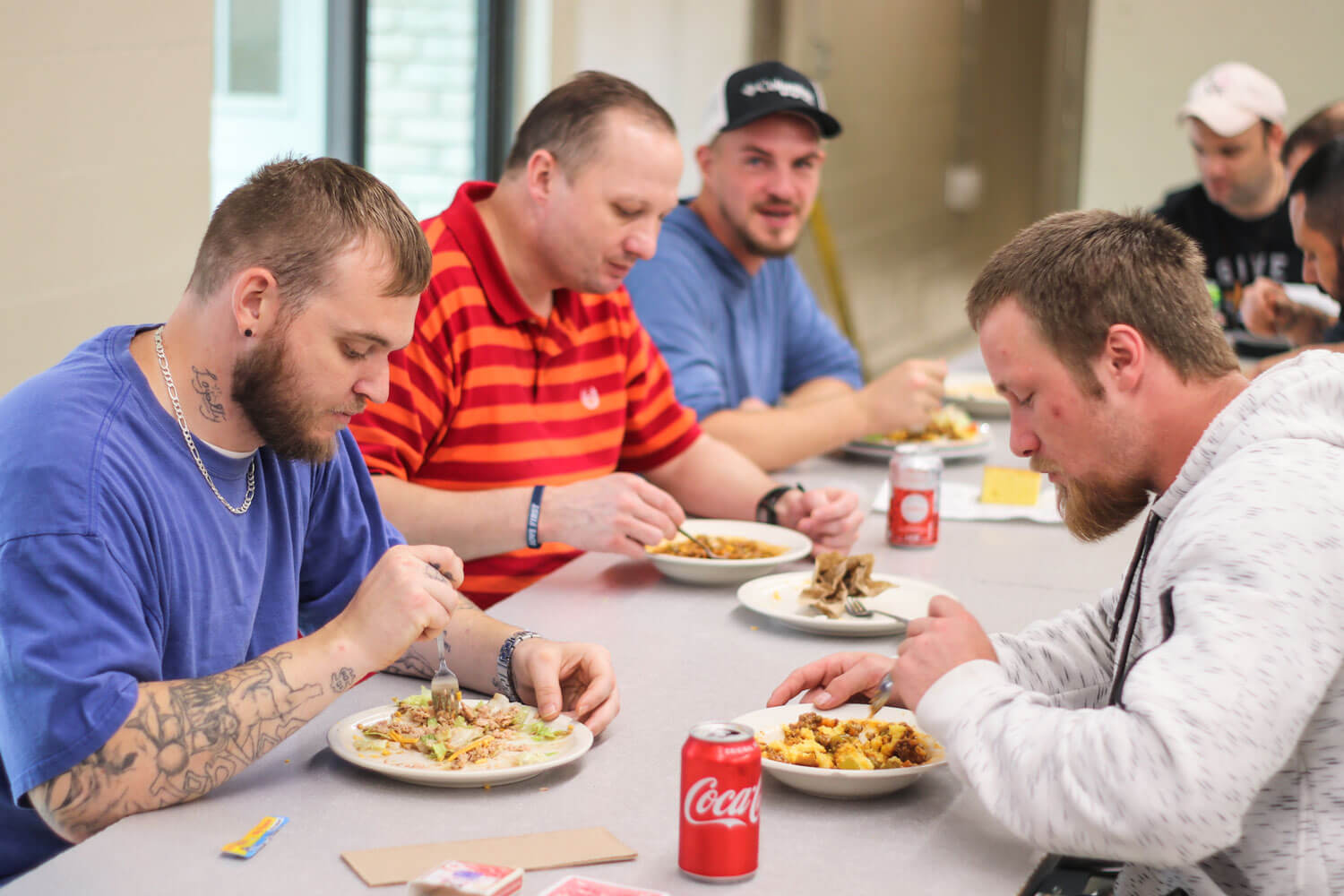 Clients eating in cafeteria at The Potter's House
