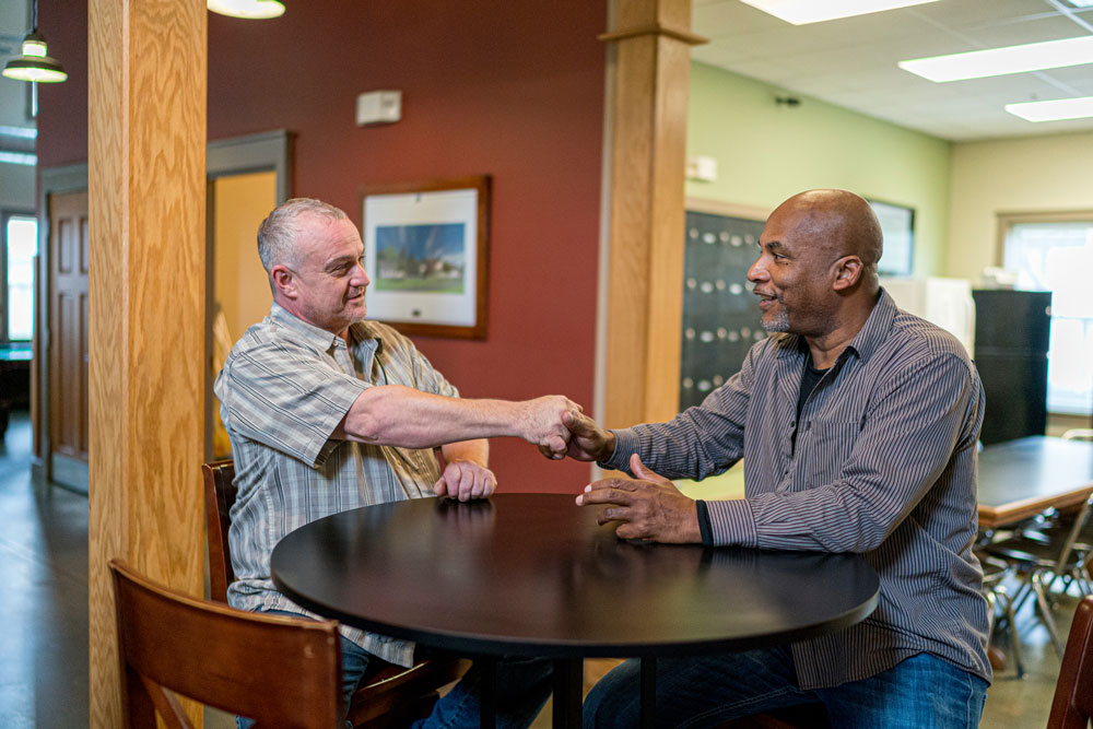 Men talking at The Potter's House