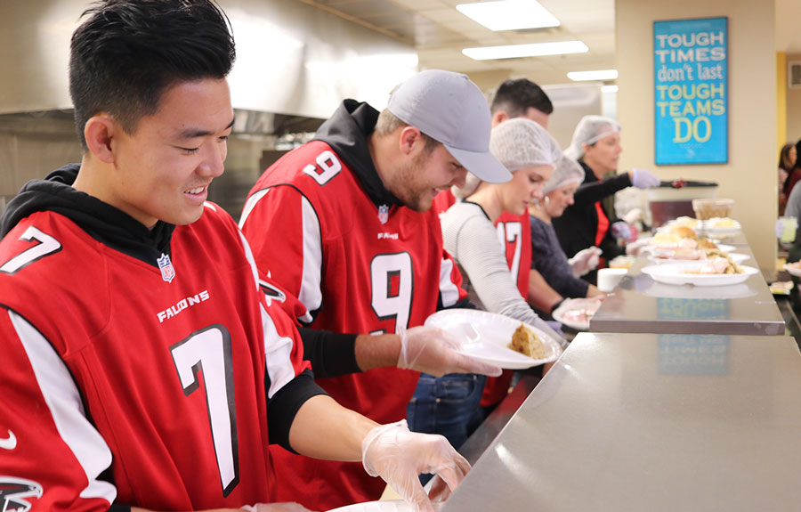 Atlanta Falcons serving food at MSH