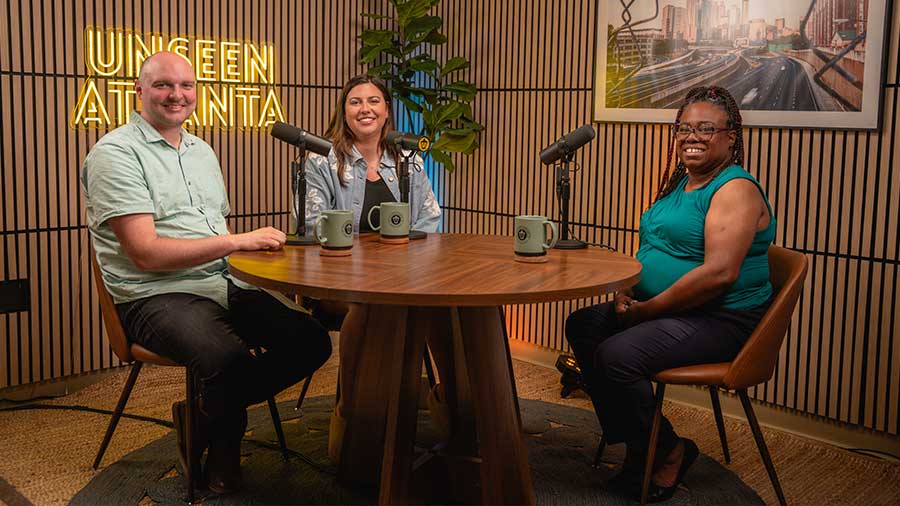 Podcast hosts Jonathan and Rachel with guest Candy