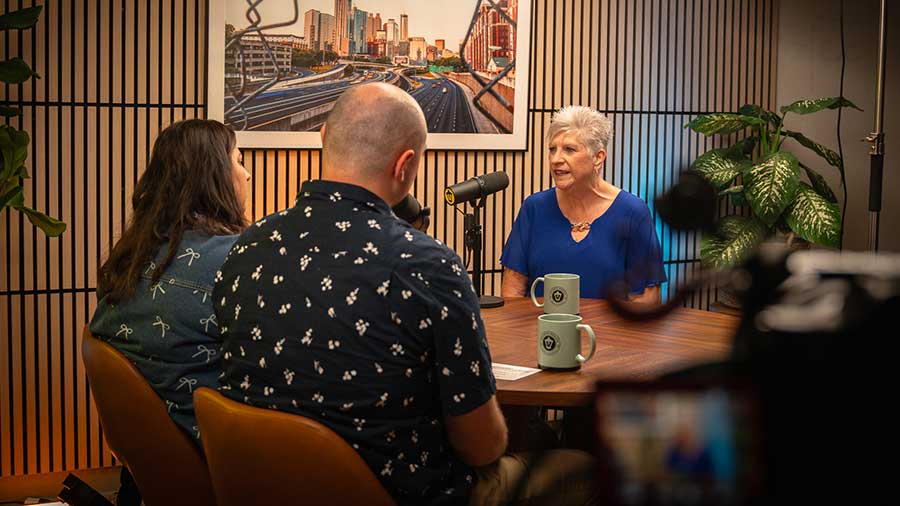 Podcast hosts Rachel and Jonathan with guest Kathy Rainwater-Roe