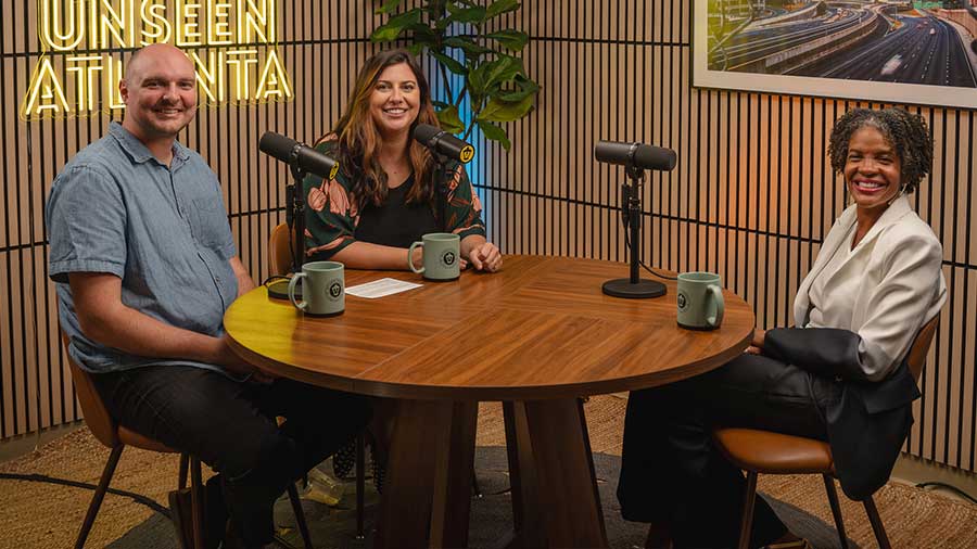 Podcast hosts Jonathan and Rachel with guest Adria