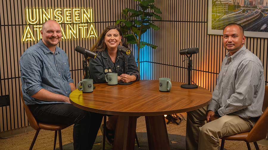 Podcast hosts Rachel and Jonathan with guest Denh