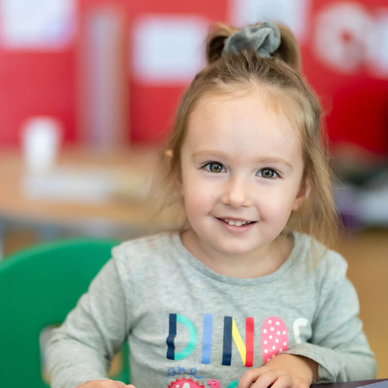 Young girl smiling at camera